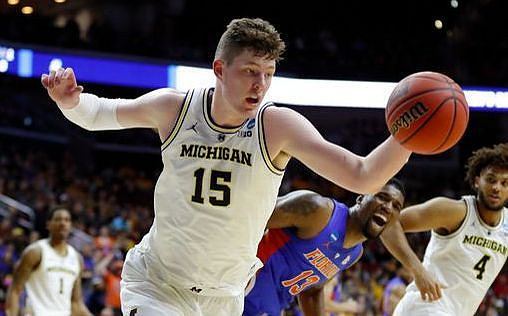 Charles Matthews (1), Jon Teske (15), and Isaiah Livers (4)