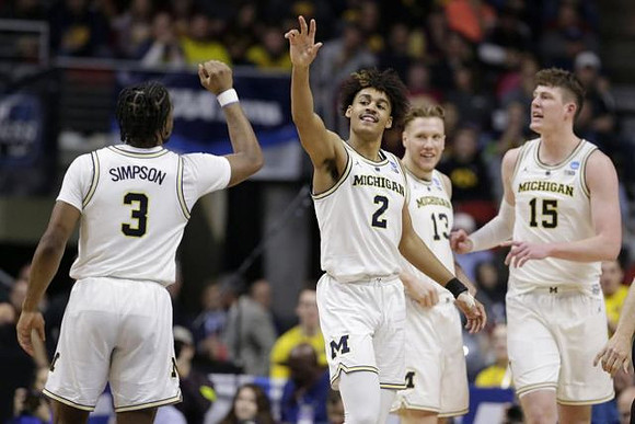 Zavier Simpson (3), Jordan Poole (2), Ignas Brazdeikis (13), and Jon Teske (15)