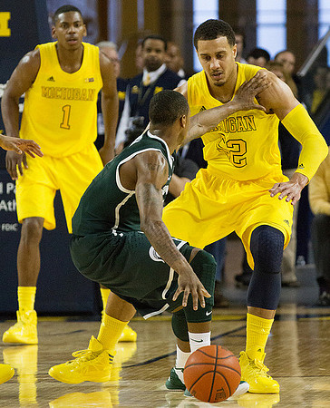 Glenn Robinson III (1) and Jordan Morgan (52)