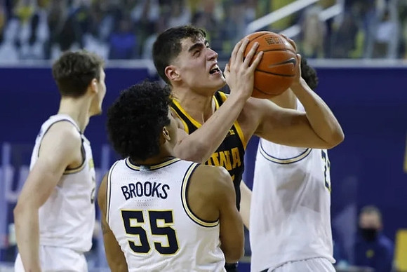 Franz Wagner (21), Eli Brooks (55), and Brandon Johns Jr. (23)