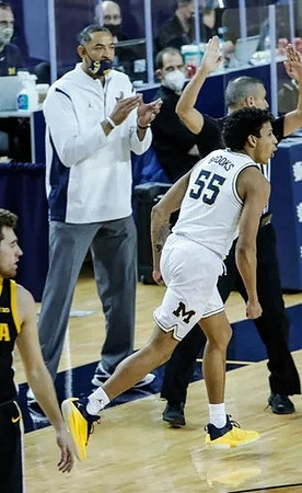 Eli Brooks (55) and Juwan Howard