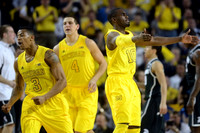 Trey Burke (3), Mitch McGary (4), and Tim Hardaway Jr. (10)