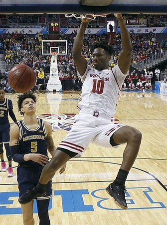 Muhammad-Ali Abdur-Rahkman (12) and D.J. Wilson (5)