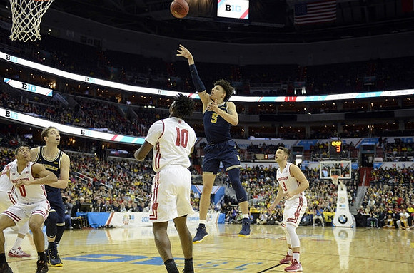 Mark Donnal (34) and D.J. Wilson (5)