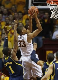 Glenn Robinson III (1) and Jordan Morgan (52)