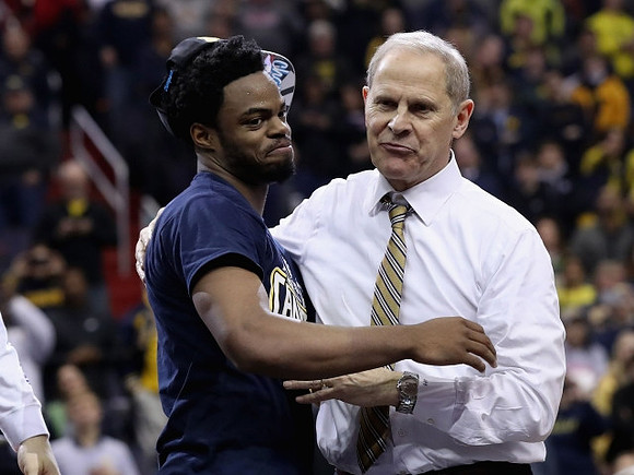 Derrick Walton Jr. (10) and John Beilein