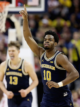 Moritz Wagner (13) and Derrick Walton Jr. (10)