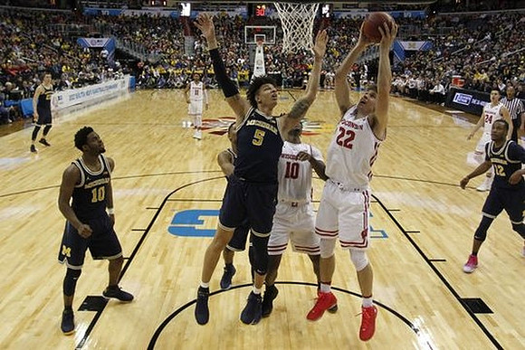 Duncan Robinson (22), Derrick Walton Jr. (10), D.J. Wilson (5), and Muhammad-Ali Abdur-Rahkman (12)
