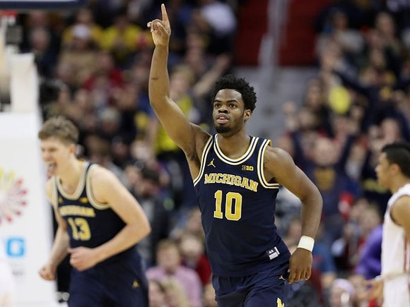 Moritz Wagner (13) and Derrick Walton Jr. (10)