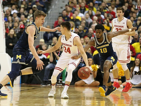 Moritz Wagner (13) and Derrick Walton Jr. (10)