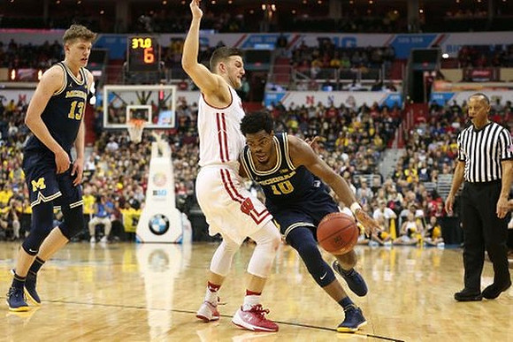 Moritz Wagner (13) and Derrick Walton Jr. (10)