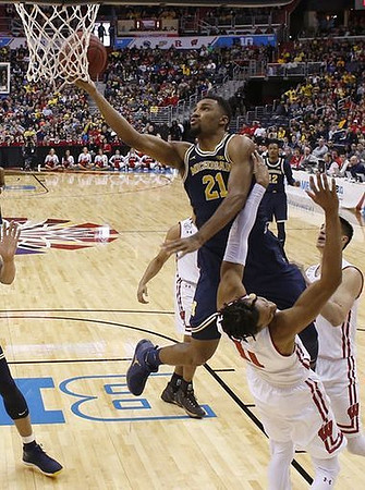 Zak Irvin (21) and Muhammad-Ali Abdur-Rahkman (12)