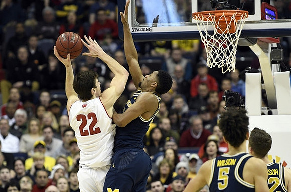 Zak Irvin (21), D.J. Wilson (5), and Duncan Robinson (22)