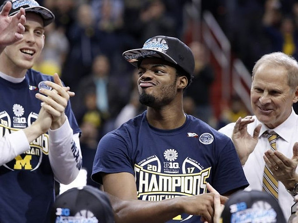 Austin Davis (51), Derrick Walton Jr. (10), and John Beilein