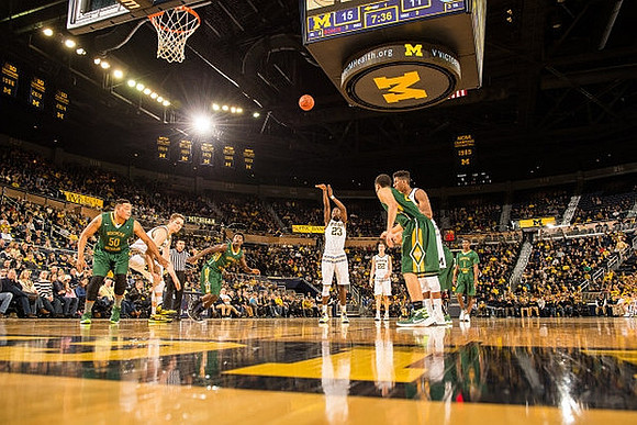 Mark Donnal (34), Caris LeVert (23), and Duncan Robinson (22)