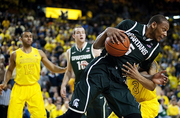 Jon Horford (15) and Trey Burke (3)