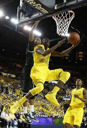 Caris LeVert (23) and Glenn Robinson III (1)