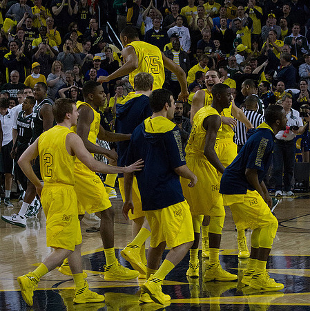 Spike Albrecht (2), Glenn Robinson III (1), Josh Bartelstein (20), Blake McLimans (22), Jon Horford (15), Caris LeVert (23), Mitch McGary (4), and Corey Person (32)