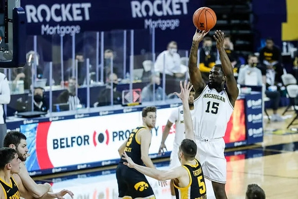 Chaundee Brown Jr. (15), Hunter Dickinson (1), and Mike Smith (12)