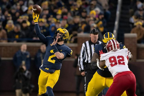 Shea Patterson (2) and Michael Onwenu (50)