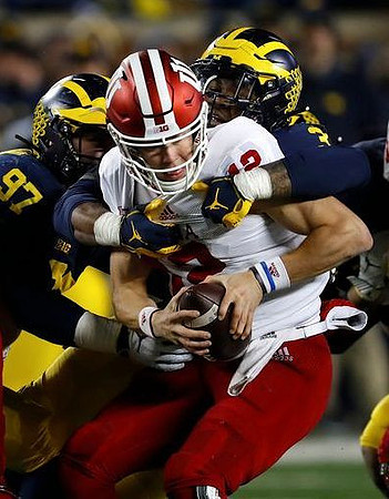 Aidan Hutchinson (97) and Rashan Gary (3)