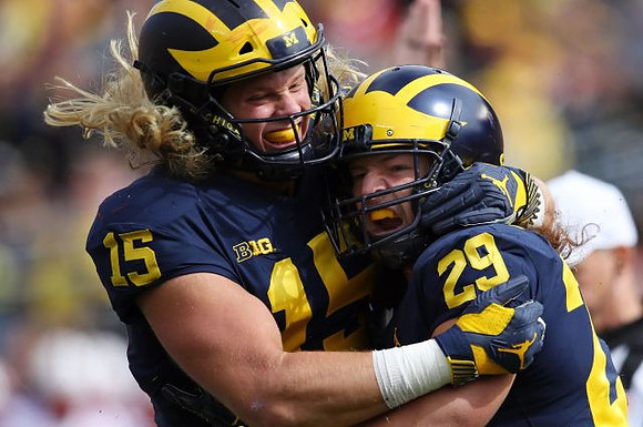 Chase Winovich (15) and Jordan Glasgow (29)
