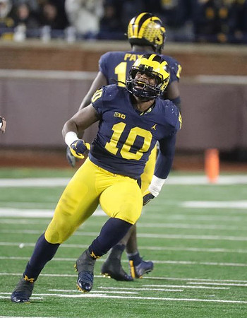 Devin Bush (10) and Kwity Paye (19)
