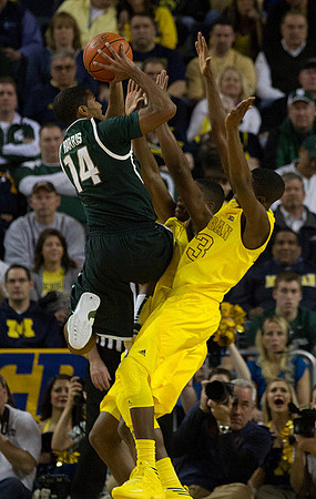 Tim Hardaway Jr. (10) and Caris LeVert (23)