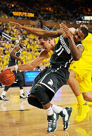 Mitch McGary (4) and Glenn Robinson III (1)