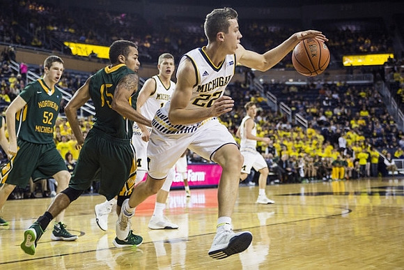 Duncan Robinson (22), Moritz Wagner (13), and Ricky Doyle (32)