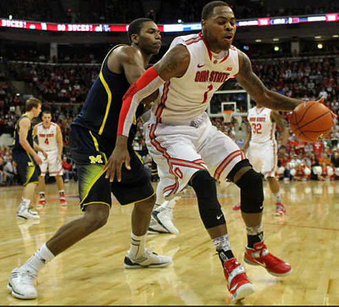 Glenn Robinson III (1) and Spike Albrecht (2)