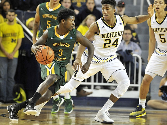 Aubrey Dawkins (24) and D.J. Wilson (5)