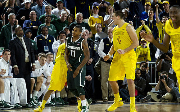 Trey Burke (3), Mitch McGary (4), and Caris LeVert (23)
