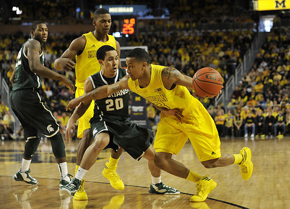 Glenn Robinson III (1) and Trey Burke (3)