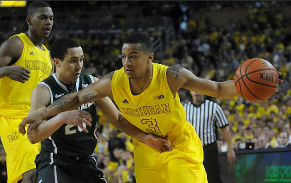 Glenn Robinson III (1) and Trey Burke (3)