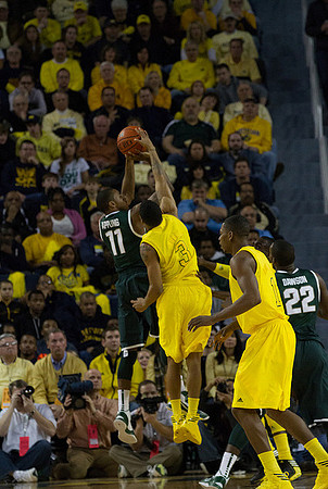 Trey Burke (3) and Glenn Robinson III (1)
