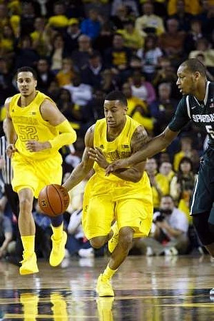 Jordan Morgan (52) and Trey Burke (3)