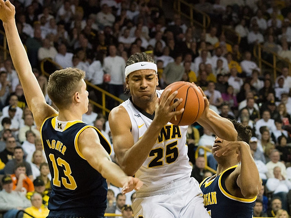 Moritz Wagner (13) and D.J. Wilson (5)