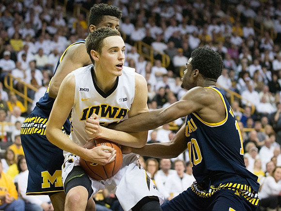 Aubrey Dawkins (24) and Derrick Walton Jr. (10)