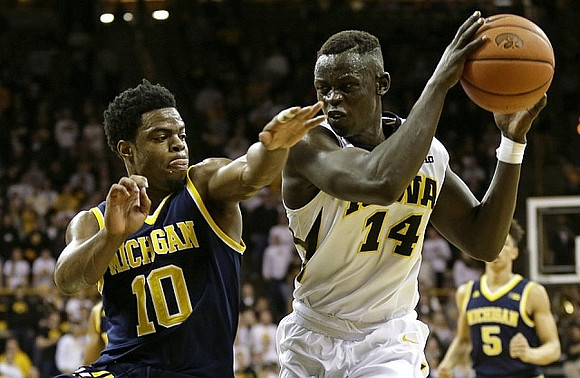 Derrick Walton Jr. (10) and D.J. Wilson (5)
