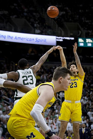 Jon Teske (15) and Brandon Johns Jr. (23)
