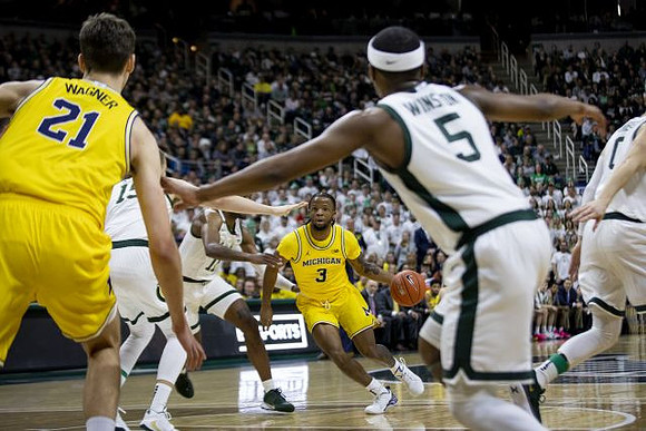 Franz Wagner (21) and Zavier Simpson (3)