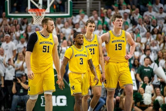 Austin Davis (51), Zavier Simpson (3), Franz Wagner (21), and Jon Teske (15)