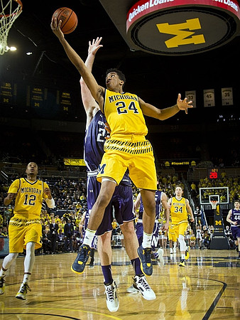Muhammad-Ali Abdur-Rahkman (12), Aubrey Dawkins (24), and Mark Donnal (34)
