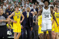 Franz Wagner (21), Juwan Howard, Phil Martelli, Saddi Washington, Zavier Simpson (3), and Austin Davis (51)