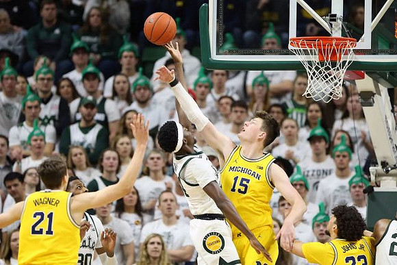Franz Wagner (21), Jon Teske (15), and Brandon Johns Jr. (23)