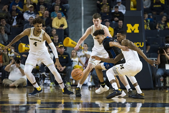 Isaiah Livers (4), Jon Teske (15), and Charles Matthews (1)