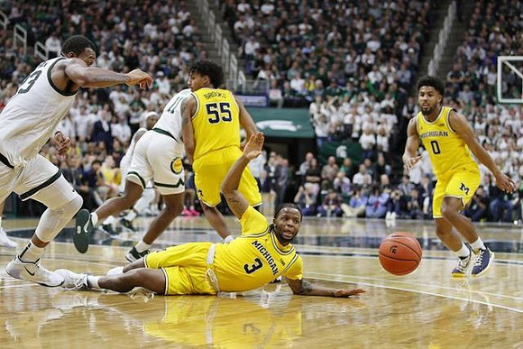 Zavier Simpson (3), Eli Brooks (55), and David DeJulius (0)