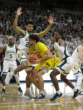 Brandon Johns Jr. (23) and Eli Brooks (55)