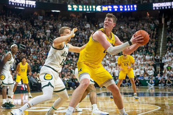 Eli Brooks (55), Jon Teske (15), and Brandon Johns Jr. (23)